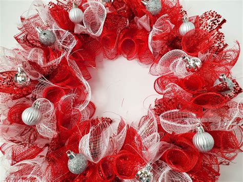 Secure the loose end with hot glue. . Dollar tree mesh christmas wreath